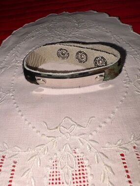 Plunder ID camo color bracelet, adj. 3 snaps to close, length 8 1/2”  $10